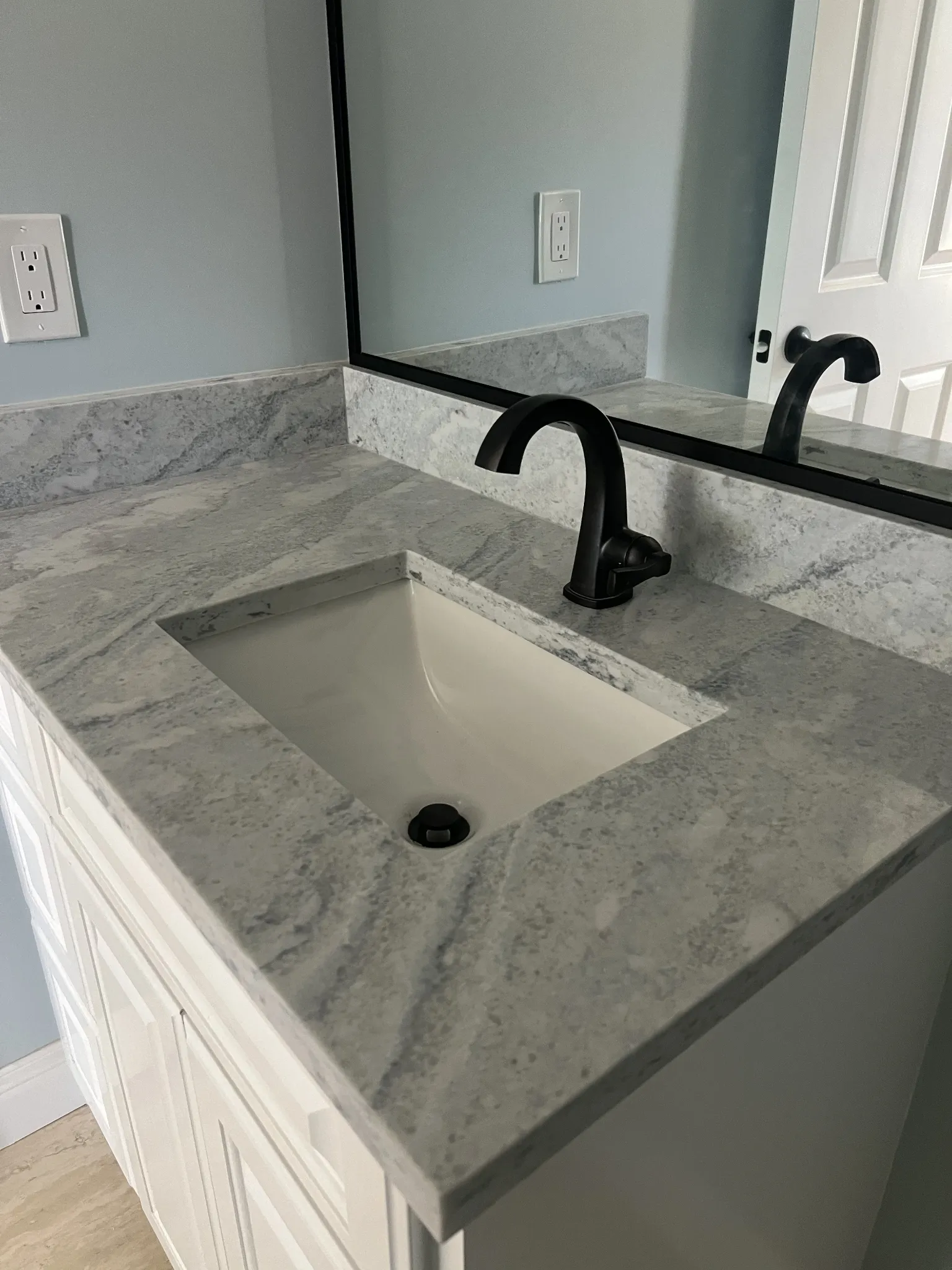 Completed residential vanity faucet and sink plumbing installation in North Texas